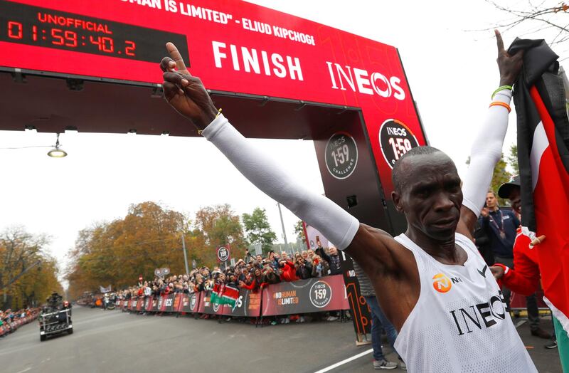 Kenya's Eliud Kipchoge, the marathon world record holder, celebrates after crossing the finish line during his attempt to run a marathon in under two hours in Vienna, Austria. REUTERS