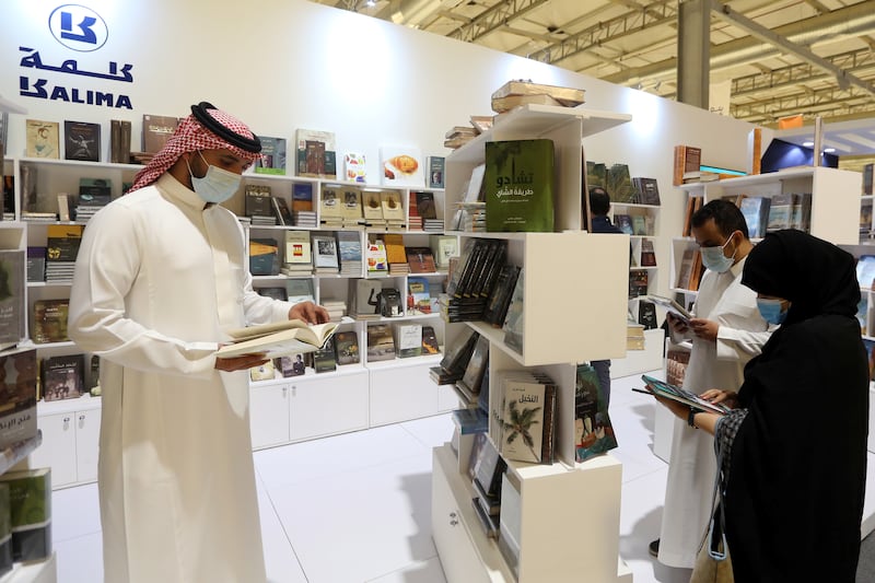 Visitors browse through books at the Riyadh International Book Fair.