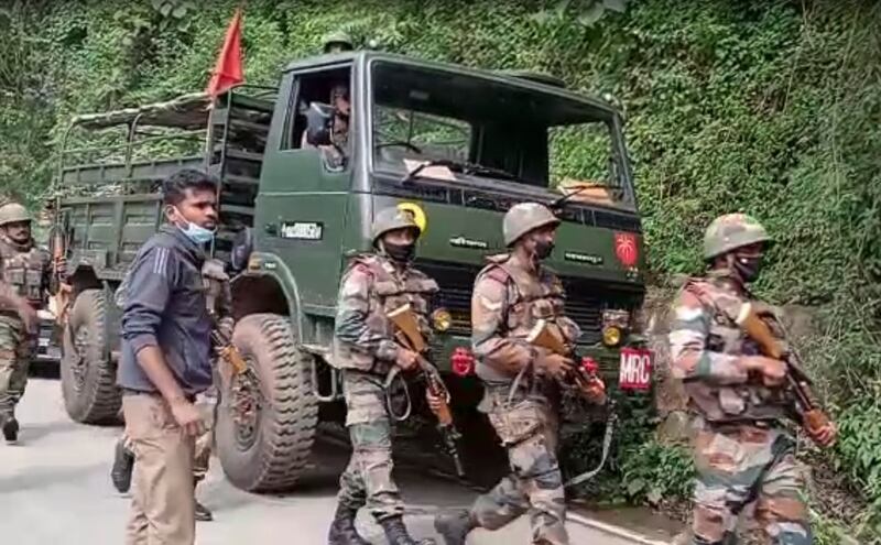 This image from video shows Indian army soldiers arriving at the site.  AP