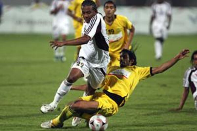 Al Wadha, in white, and Al Wasl are just two of 31 registered clubs in the United Arab Emirates.