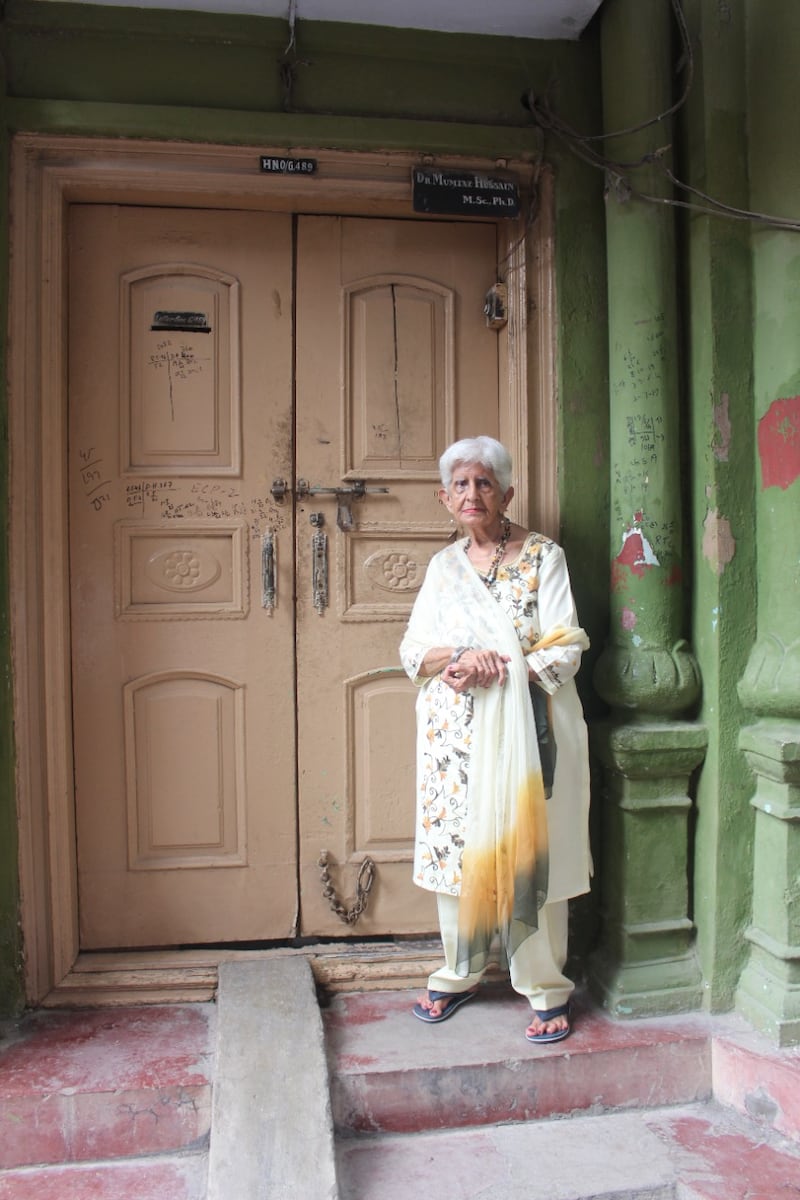 Ms Verma standing outside her ancestral home, now owned by Pakistani Muslims, in Rawalpindi in Pakistan. She lived in the house for 15 years before migrating to India in 1947. 