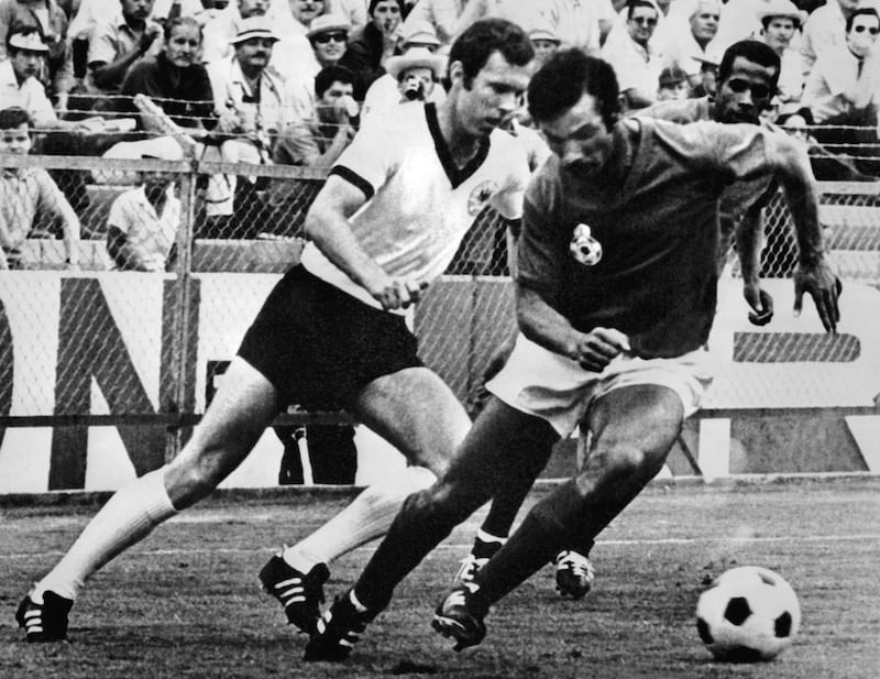 Franz Beckenbauer, left, fights for the ball with Moroccan Benkhrif Boujemaa during the World Cup first round match between West Germany and Morocco, June 1970 in Leon. AFP