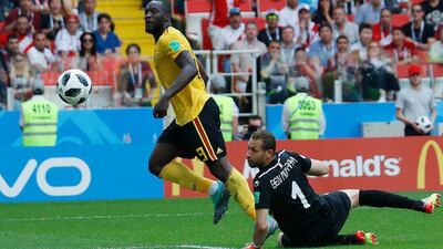 Belgium's Romelu Lukaku, left, scores his second and Belgium's third goal past Tunisia goalkeeper Farouk Ben Mustapha in a 5-2 win at Spartak Stadium in Moscow. Hassan Ammar / AP Photo