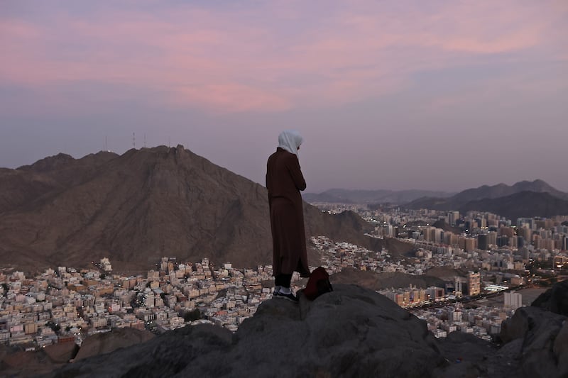 A pilgrim looks over Makkah from on top Jabal Al Noor in July 2022. AFP