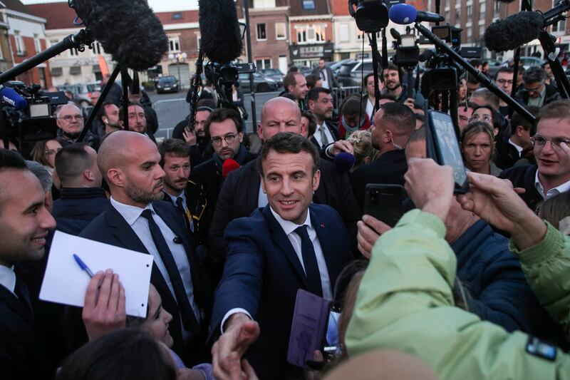 French President Emmanuel Macron, centre, in Carvin, northern France, on April 11. EPA
