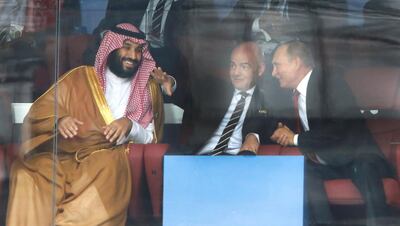 Saudi Arabia Crown Prince Mohammed bin Salman, left, FIFA President Gianni Infantino, center, and Russian President Vladimir Putin watch the match between Russia and Saudi Arabia which opens the 2018 soccer World Cup at the Luzhniki stadium in Moscow, Russia, Thursday, June 14, 2018. (AP Photo/Hassan Ammar)