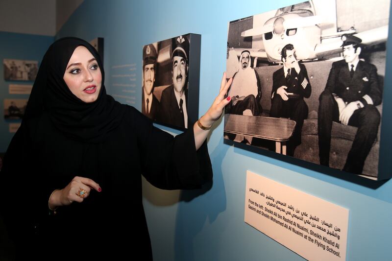 Capt Al Deeb's daughter Nora explains the background to photos on display at the ‘Sharjah, The First UAE Flying School’ exhibition at Al Mahatta Museum. Photo: Sharjah Museums Authority.