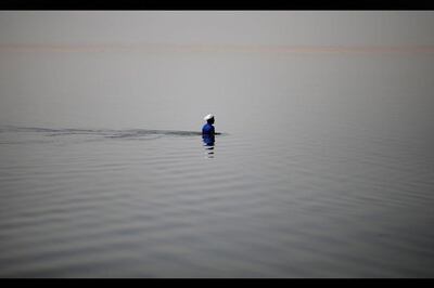 An Egyptian fisherman fishes with a net in Lake Qarun south of Fayoum, Egypt. Hassan Ammar / AP Photo