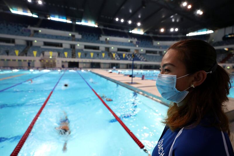 Dubai, United Arab Emirates - Reporter: N/A. News. Coronavirus/Covid-19. A swimming coach wears a mask to prevent the spread of Covid-19 at Hamdan sports complex. Monday, November 2nd, 2020. Dubai. Chris Whiteoak / The National
