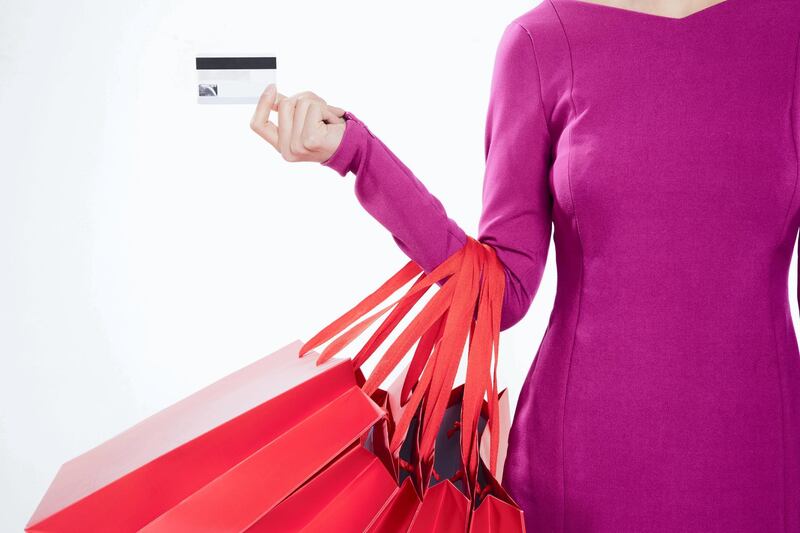 A woman with several shopping bags - stock photo