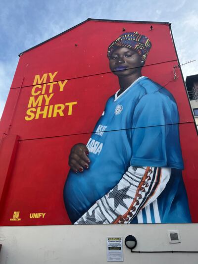 A 'My City, My shirt' mural in the Butetown area of Cardiff. The artwork aimed to help the area's multicultural community connect with the city. Paul Carey / The National