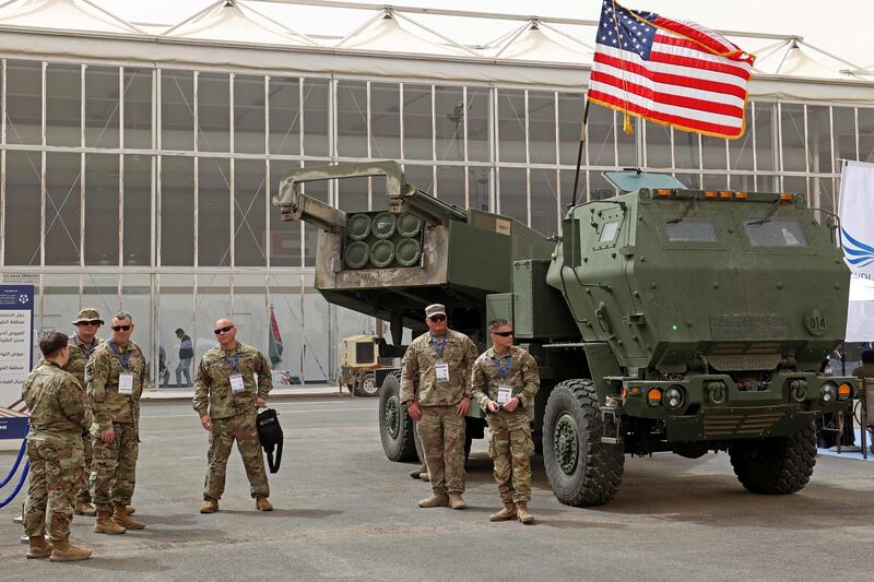 US military personnel stand by a Himars vehicle during a defence show in Saudi Arabia. AFP