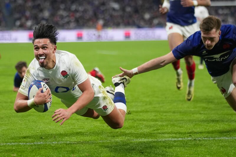 England's Marcus Smith scores a try during the Six Nations rugby union match against France at Groupama Stadium, Lyon. France won 33-31. AP
