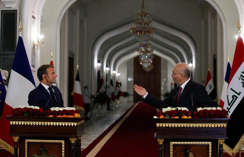 French President Emmanuel Macron and Iraq's President Barham Salih attend a news conference at the Salam Palace in Baghdad.  EPA