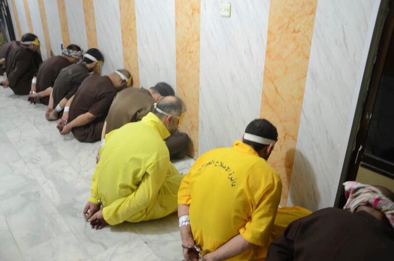 This photo released by Iraq's Ministry of Justice on Friday, June 29, 2018 shows nine blindfolded prisoners ahead of their execution in Iraq. The office of the Iraqi prime minister says authorities have executed 12 prisoners convicted on terror charges, following a recommendation by the premier to hasten executions. Haidar al-Abadi's office announced on Friday that the convicts were hanged the previous evening.(Iraq Ministry of Justice via AP)