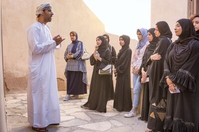 A group of female Omani diploma students practice tour guiding with Bader Thuhli, a professor of tour guiding at the Oman Tourism College, the only college in the Sultanate of Oman specializes Tourism & Hospitality.