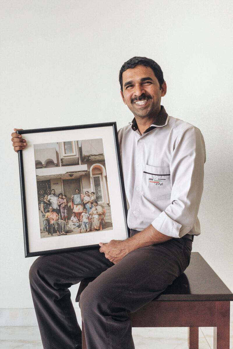 Benny receives the picture of his family with the portrait of him. Courtesy Waleed Shah and Nikith Nath