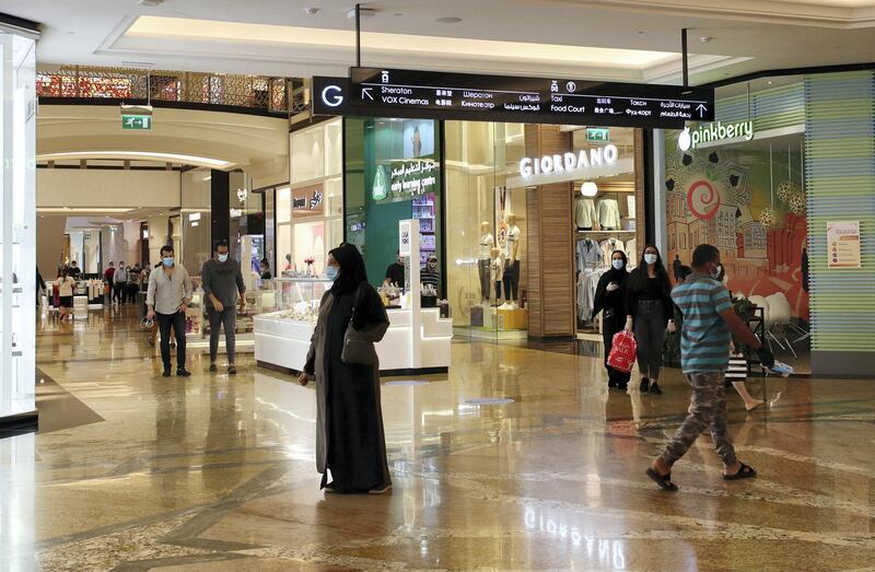 DUBAI, UNITED ARAB EMIRATES , April 29 – 2020 :- Shoppers wearing protective face mask to prevent the spread of the coronavirus at Mall of the Emirates in Dubai. Authorities ease the restriction for the residents in Dubai. At present mall opening timing is 12:00 pm to 10:00 pm. Carrefour timing is 9:00 am to 10:00 pm. (Pawan Singh / The National) For News/Standalone/Online. Story by Patrick