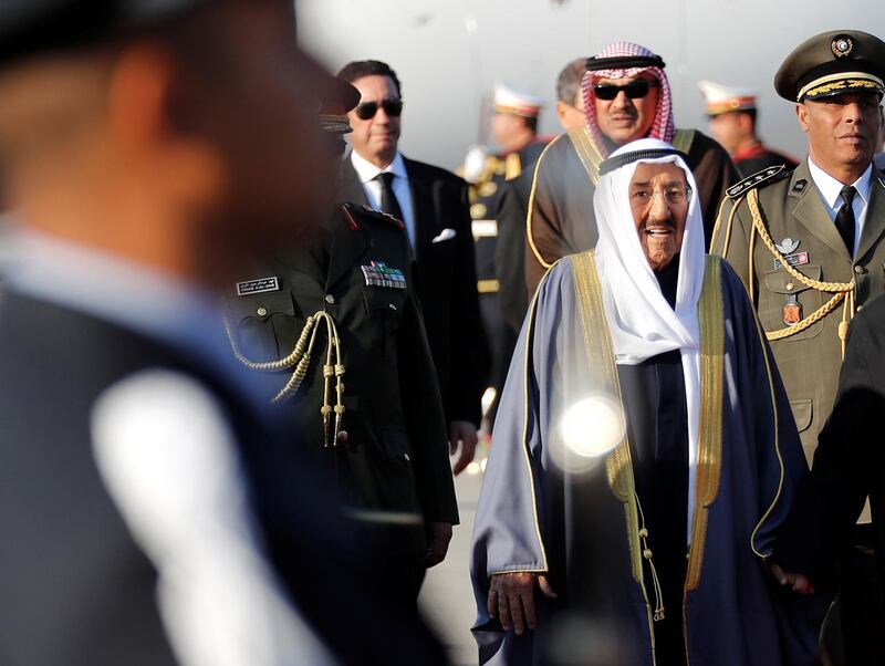 Kuwait's Emir Sheikh Sabah Al-Ahmad Al-Jaber Al-Sabah reviews an honour guard upon his arrival at Tunis-Carthage international airport. Reuters