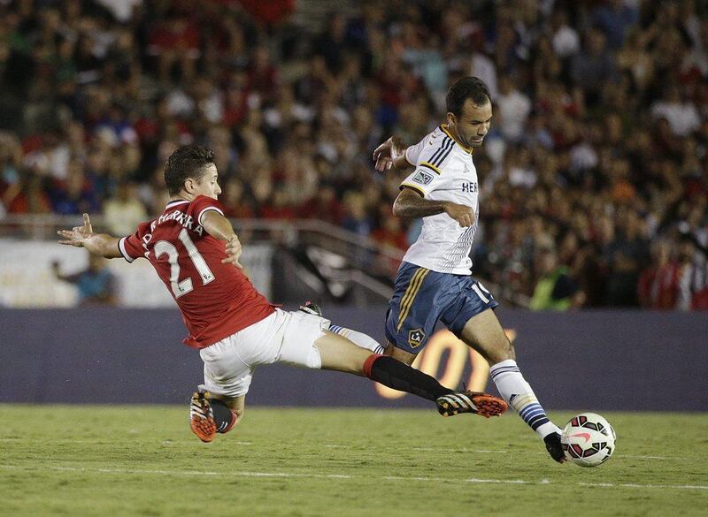 Manchester United's Ander Herrera, left, challenges LA Galaxy's Juninho, right, during their international friendly on Wednesday at the Rose Bowl in Pasadena, California. AP Photo