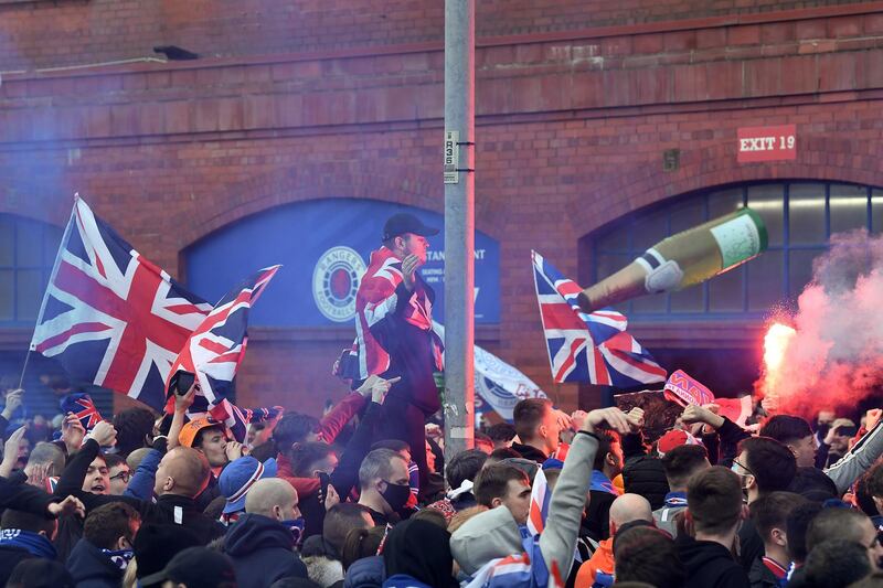 Rangers fans gather at Ibrox stadium to celebrate the club winning the Scottish Premiership for the first time in 10 years. Getty
