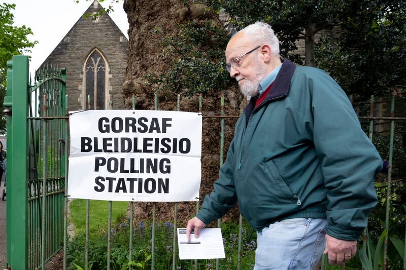 A man arrives at a polling station in Cardiff, Wales. Getty Images