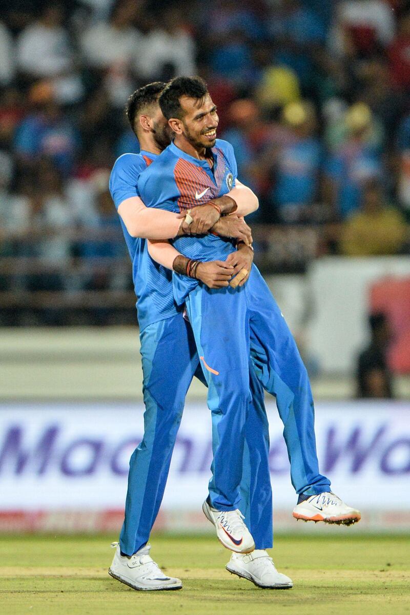 India's Yuzvendra Chahal (R) is huged by teammate Deepak Chahar after he dismissed  Bangladesh's Soumya Sarkar during the second T20 international cricket match of a three-match series between Bangladesh and India at Saurashtra Cricket Association Stadium in Rajkot on November 7, 2019. ----IMAGE RESTRICTED TO EDITORIAL USE - STRICTLY NO COMMERCIAL USE-----
 / AFP / Sajjad HUSSAIN / ----IMAGE RESTRICTED TO EDITORIAL USE - STRICTLY NO COMMERCIAL USE-----
