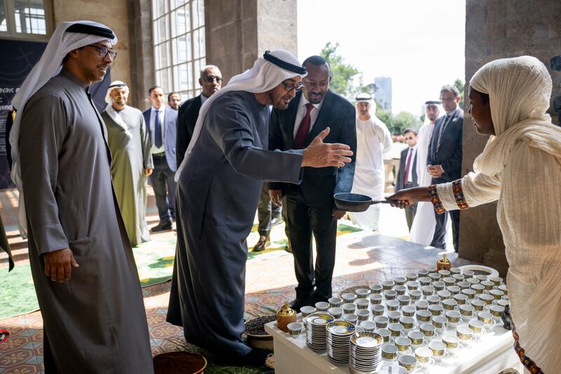 President Sheikh Mohamed and Mr Abiy watch Ethiopian coffee being prepared