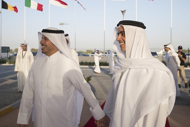 Lt Gen Sheikh Saif bin Zayed, Deputy Prime Minister and Minister of Interior, right, with Sheikh Abdullah bin Nasser bin Khalifa Al Thani, Prime Minister of Qatar, at the Grand Prix. Ryan Carter / Crown Prince Court - Abu Dhabi