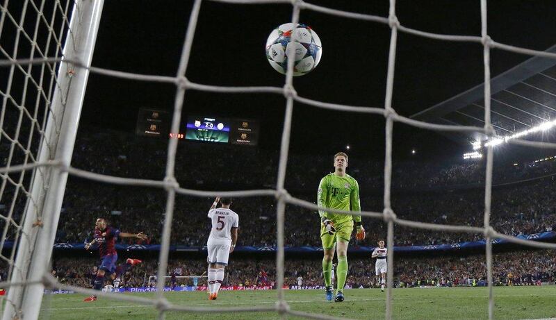Bayern Munich keeper Manuel Neuer watches the ball go into the net as Barcelona's Neymar scores their third goal on Wednesday in their Champions League contest. Paul Hanna / Rueters