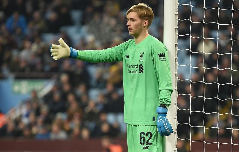 Liverpool's Irish goalkeeper Caoimhin Kelleher gestures to his teammates during the English League Cup quarter-final football match between Aston Villa and Liverpool at Villa Park in Birmingham, central England, on December 17, 2019. (Photo by Paul ELLIS / AFP) / RESTRICTED TO EDITORIAL USE. No use with unauthorized audio, video, data, fixture lists, club/league logos or 'live' services. Online in-match use limited to 120 images. An additional 40 images may be used in extra time. No video emulation. Social media in-match use limited to 120 images. An additional 40 images may be used in extra time. No use in betting publications, games or single club/league/player publications. / 
