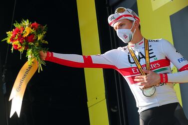 epa08666836 Slovenian rider Tadej Pogacar of the UAE-Team Emirates celebrates on the podium after winning the 15th stage of the Tour de France over 174.5km from Lyon to Grand Colombier, France, 13 September 2020. EPA/Thibault Camus / Pool