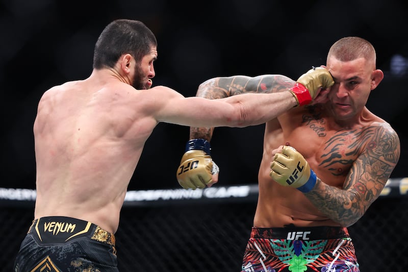 Islam Makhachev lands a punch on Dustin Poirier during their bout at UFC 302. AFP