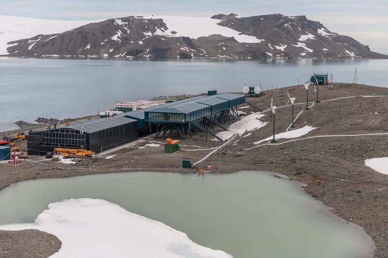 KING GEORGE ISLAND, ANTARCTICA - DECEMBER 25: Detail of North Lake that supplies water to Comandante Ferraz Station, with a view of the solar power wall, wind power plant and internet module, on December 25, 2019 in King George Island, Antarctica. (Photo by Alessandro Dahan/Getty Images)