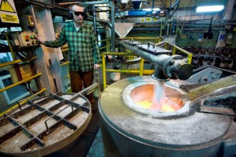 An employee monitors the melting of silver concentrate at the KGHM Miedz owned smelting facility in Glogow, Poland, on Thursday, March 4, 2010. KGHM Polska Miedz SA, the copper producer with the largest European mine output, said 2009 net income fell to 2.54 billion zloty ($868 million) from 2.92 billion zloty a year earlier, meeting its 2.5 billion-zloty forecast from last week. Photographer: John Guillemin/Bloomberg *** Local Caption ***  644103.jpg