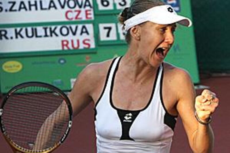 Regina Kulikova celebrates her victory over Sandra Zahlavova last night to clinch the Al Habtoor Tennis Challenge title.