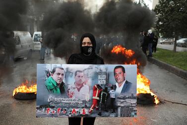 A relative of one of the victims of the Beirut port explosion takes part in a protest outside the Justice Palace in Beirut, Lebanon on February 19, 2021 after the supreme court removed the judge leading the investigation into the blast. Reuters