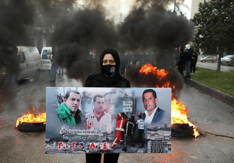 A relative of one of the victims of Beirut port explosion, takes part in a protest, after a Lebanese court removed the judge leading the investigation into the explosion, outside the Justice Palace in Beirut, Lebanon February 19, 2021. REUTERS/Mohamed Azakir