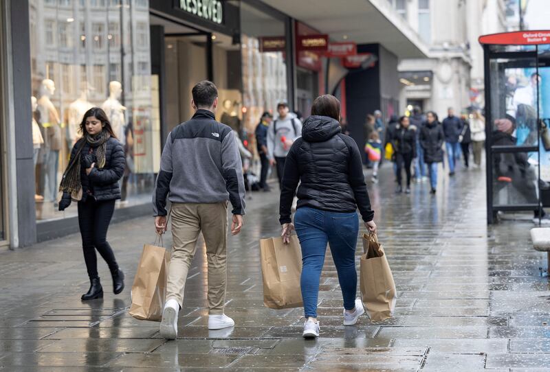 A third of consumers in a KPMG survey are shopping at lower-cost retailers or buying cheaper branded goods. Reuters