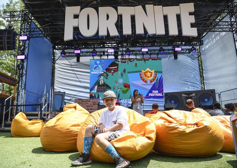 Fans attend day one of the Fortnite World Cup Finals at Arthur Ashe Stadium in the Queens borough of New York City. AFP