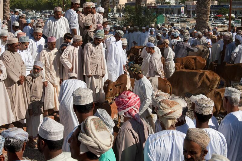 Crowd scene with buyers and sellers at the livestock market, Nizwa, Sultanate of Oman. (Photo by: Gunter Fischer/Education Images/Universal Images Group via Getty Images)