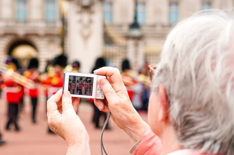 A tourist takes pictures during the Changing the Guard ceremony. AP Photo