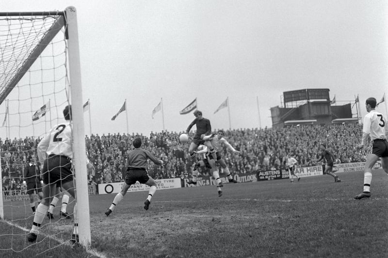 Manchester City's Colin Bell attempts a header on goal but his effort is saved by Fulham goalkeeper Ian Seymour. Also pictured for Fulham is Barry Mealand (2).