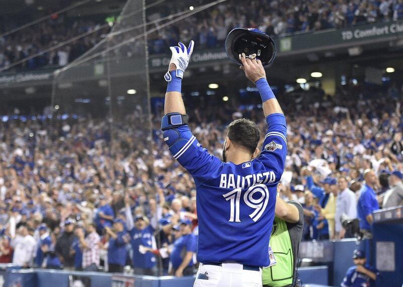 Toronto Blue Jays player Jose Bautista acknowledges the crowd after his home run to eventually win the game against the Texas Rangers on Wednesday night in the ALDS. Nathan Denette / The Canadian Press / AP