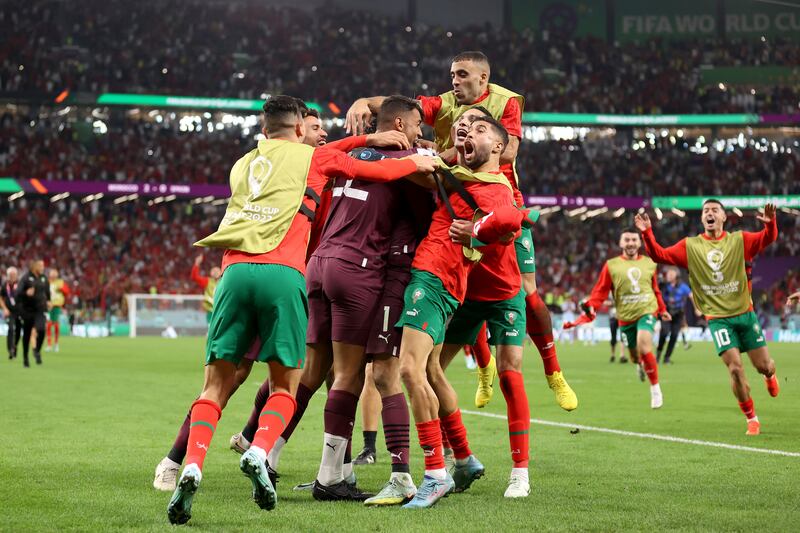 Morocco's players celebrate after their 3-0 penalty shoot-out victory in the World Cup Round of 16 match against Spain at Education City Stadium on December 6, 2022, in Al Rayyan, Qatar. Getty 