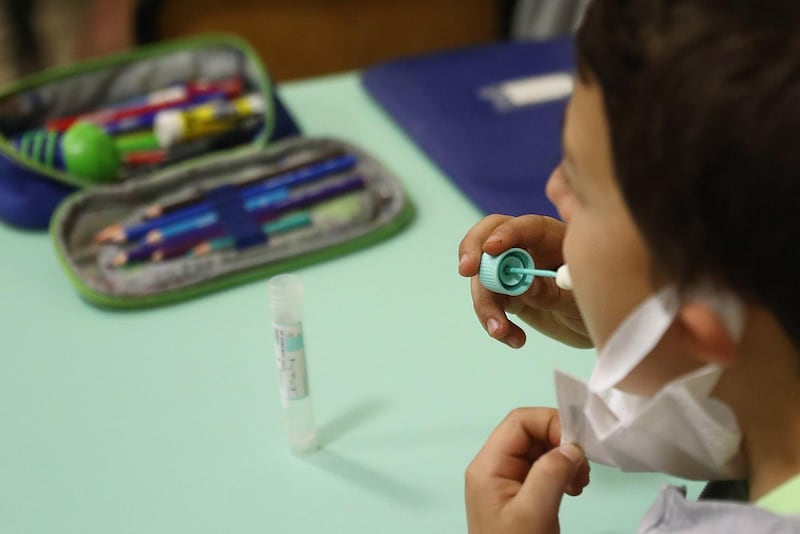 Pupils undergo salivary swabs, at the primary school of Travagliato, near Brescia, Italy. These salivary swab tests are like a lollipop candy to hold in the mouth for a minute, and the exam is done. This is the new salivary test to identify the infection from Covid-19.  EPA