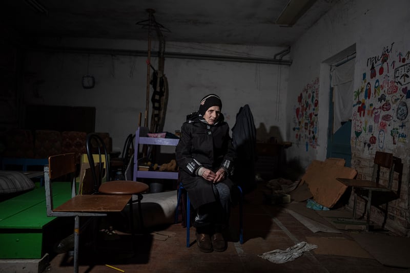 Valentina Saroyan sits in the basement of a school in Yahidne, near Chernihiv, Ukraine.  AP