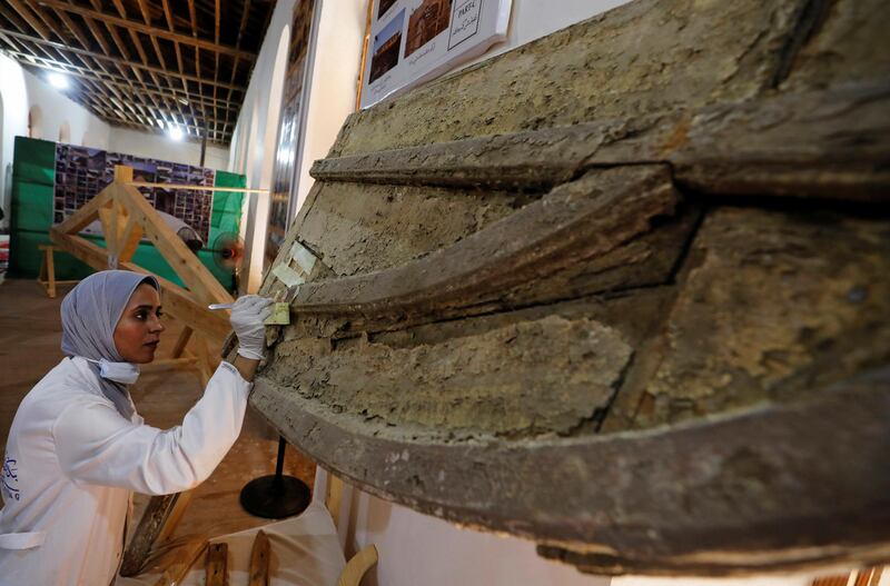 An archaeologist works on objects at the Suez Canal International Museum as Egypt celebrates the 150th anniversary of the canal opening in Ismailia, Egypt. Reuters