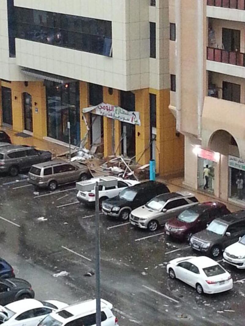 Shop signage collapses on Khalifa Street near the Abu Dhabi corniche.  Courtesy Hisham Salem