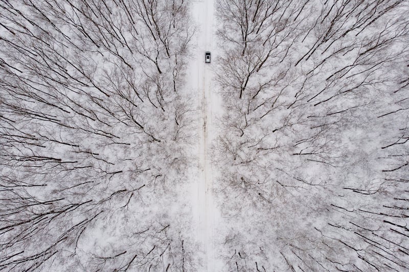 A car driving through a snow-covered landscape near Debrecen, Hungary. EPA